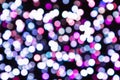 Defocussed background image of white, purple and grey lights on the black backdrop Royalty Free Stock Photo