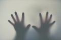 Reaching through the haze. Defocussed shot of a pair of hands reaching out against a plain background. Royalty Free Stock Photo