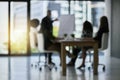 Clearing things up with a presentation. Defocussed shot of a team of businesspeople attending a meeting in the boardroom