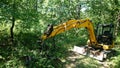 Deforestation. JCB Digger In a Forest Royalty Free Stock Photo
