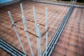 Deformed steel bars frame for beam reinforced steel footing or flooring in construction site. Royalty Free Stock Photo