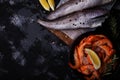 Defrosted prawns and hake fish on wet surface concept of seafood market advertising Royalty Free Stock Photo