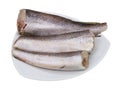 Defrosted raw hake lies on a triangular plate isolated Royalty Free Stock Photo