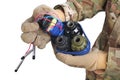 defused improvised explosive device (IED) in hand