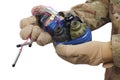 defused improvised explosive device (IED) in hand