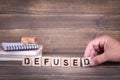 Defused. wooden letters on the office desk Royalty Free Stock Photo