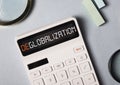 Deglobalization in business and commerse concept. Word on calculator about anti globalism, reverse globalization Royalty Free Stock Photo