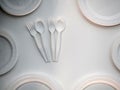 Degradable plastic spoon and fork on white background