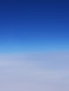 Degrading blue sky with deep blue color on top and clouds on the bottom Royalty Free Stock Photo