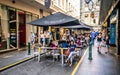 Degraves pedestrian street view full of people on sunny summer day with people eating on outdoor tables in Melbourne Australia