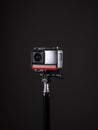 360 degree panoramic action camera on a tripod. dark background