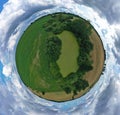 360 degree spherical drone aerial panoramic view on agricultural landscape with swamp pond, trees, fields and meadow Royalty Free Stock Photo