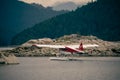 Dehavilland Beaver float plane going through a cut in an an island before take-off Royalty Free Stock Photo