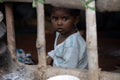 Little girl from poor family facing camera