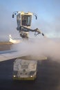 Deicing treatment of an airplane wing at Helsinki Airport