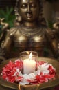 Deity Sculpture with flower petals Royalty Free Stock Photo