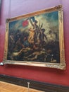 Delacroix's Liberty Leading the People on display in the Louvre Museum in Paris, France.