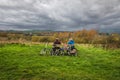 13.11.2022 Delamere, Cheshire, Uk Two cyclists sat at a bench looking at the the view of Cheshire