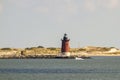 Delaware Breakwater East End Lighthouse  with sailboat Royalty Free Stock Photo