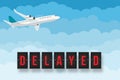 Delayed flight text with flying plane in the sky