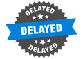 delayed sign. delayed round isolated ribbon label. Royalty Free Stock Photo