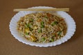 Delcious Special Fried rice in a white dish and Asian Chopsticks Royalty Free Stock Photo