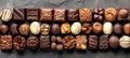 Delectable assorted chocolates display in tempting array against clean background