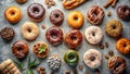 A delectable assortment of assorted glazed donuts, arranged on a rustic surface, accompanied by coffee beans, cinnamon sticks, and Royalty Free Stock Photo
