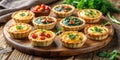 A delectable assortment of savory mini tarts, each filled with a unique and vibrant blend of ingredients, artfully arranged on a Royalty Free Stock Photo