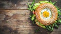 Delectable Bagel Delight: Avocado and Egg on Rustic Wooden Background Royalty Free Stock Photo