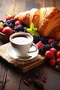 A delectable breakfast tableau featuring croissants, berries, and steaming coffee