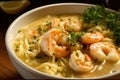 delectable close-up of a steaming bowl of shrimp scampi soup, brimming with juicy shrimp, tender pasta, and fragrant herbs