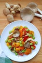 Colorful grilled vegetable salad with fresh Indian Oyster mushrooms on Wooden Table