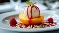 Delicious Peach Melba Dessert With Ice Cream, Raspberry Sauce and Almonds on Plate Royalty Free Stock Photo