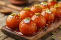 Delectable Glazed Gulab Jamun Dessert Adorned with Crushed Pistachios on Wooden Serving Board