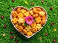 Delectable Heart Rectangular Breaded Snacks on a Floral Plate Perfect for a Spring or Summer Picnic or Party Royalty Free Stock Photo