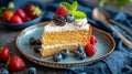 Delectable homemade strawberry sponge cake with fresh berries and whipped cream on a plate Royalty Free Stock Photo