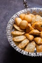 Delectable pastries arranged beautifully on a silver platter.