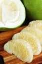 Peeled Fresh Pomelo Segments with Fruit Opened in Half in the Backdrop Royalty Free Stock Photo