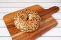 Sunflower Seeds and Pumpkin Seeds with Sesame Bun on Wooden Breadboard Royalty Free Stock Photo