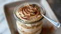 Delectable Tiramisu Dessert in Glass Jar with Spoon Royalty Free Stock Photo
