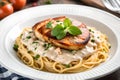 Pasta topped with chicken and cheese - AI Generated