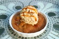 Warm Cookie Topped with Ice Cream and Salted Caramel Sauce