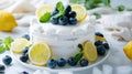 a delectable white cake adorned with slices of lemon, blueberries, and mint leaves, set against a pristine backdrop with