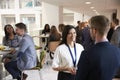 Delegates Networking During Coffee Break At Conference