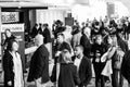 Delegates networking at a sales convention in large conference hall