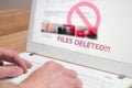 Deleted files icon on a laptop computer screen Royalty Free Stock Photo
