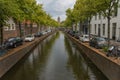 View of historic oude canal leading to view of the Oude Kerk in Delft