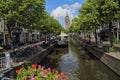 Canal and church tower in Delft, Holland Royalty Free Stock Photo