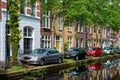 Cars on canal embankment in street of Delft. Delft, Netherlands Royalty Free Stock Photo